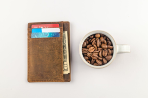 https://www.pexels.com/photo/white-mug-with-coffee-beans-beside-brown-wallet-1420707/